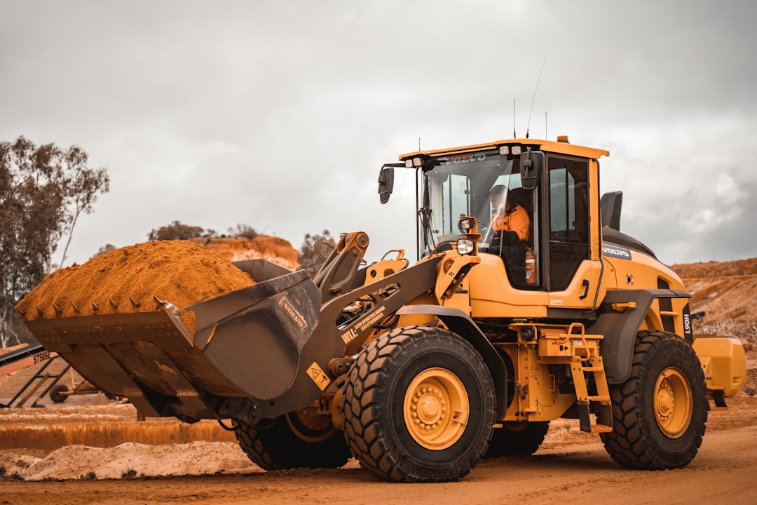 Contact yellow-and-black-heavy-equipment-on-brown-field-during-daytime-n1lbcqlp9ec
